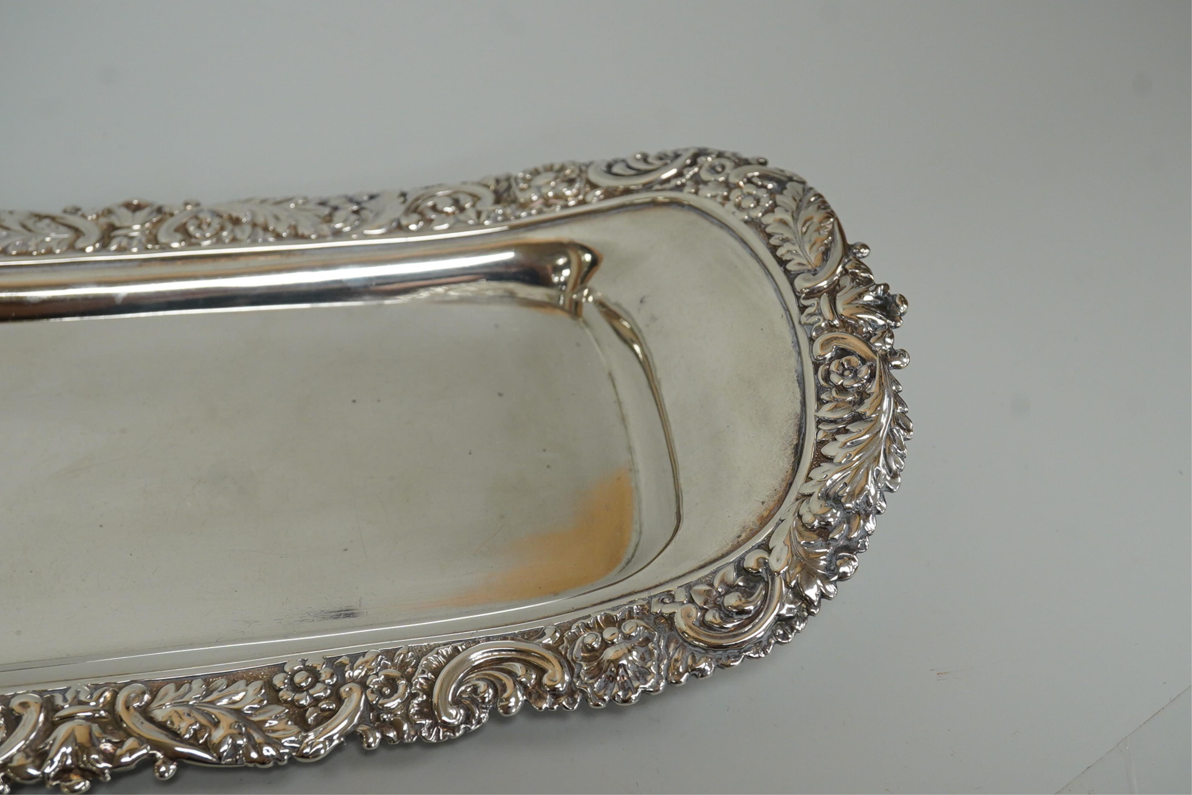 A late George III silver snuffers tray by Eames and Barnard, London, 1817, with foliate border, 26.2cm, 8.5oz.